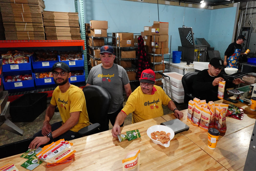 Farm to Pet production staff working hard in Chicago, Illinois facility to package and produce dog treats.